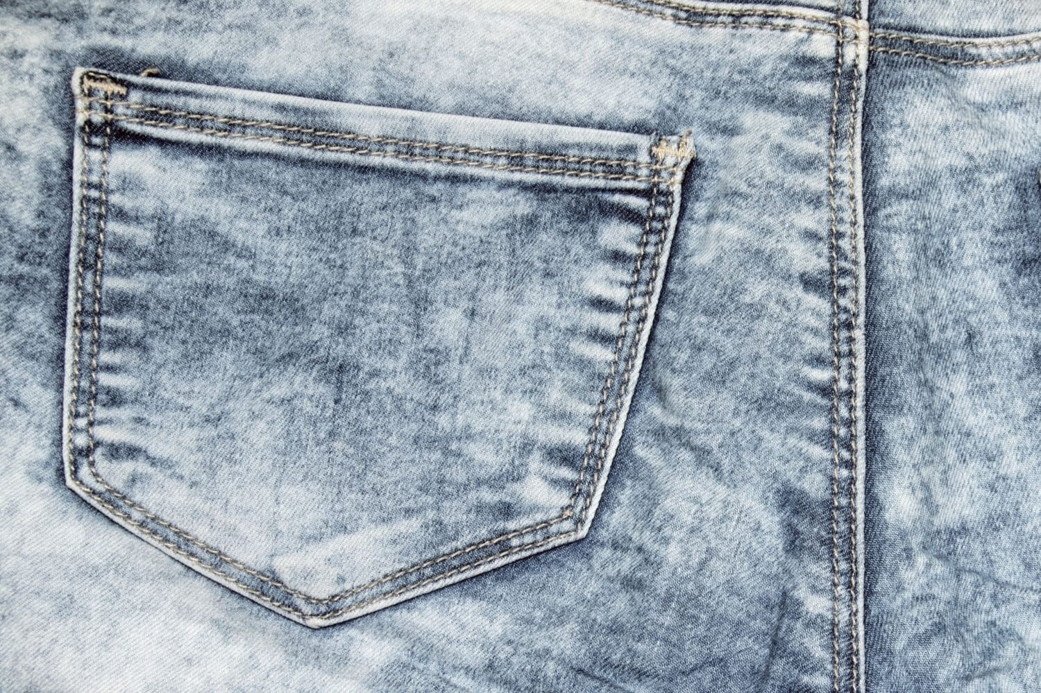 Acid washed jeans with a pocket texture of denim