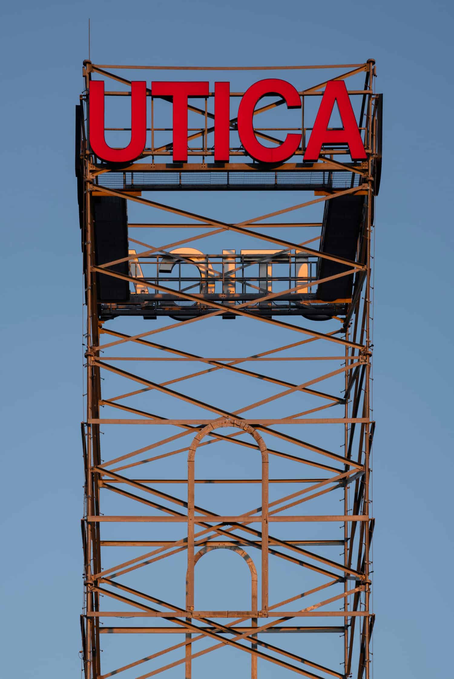 Utica City Tower Picture with Utica Sign in Red.