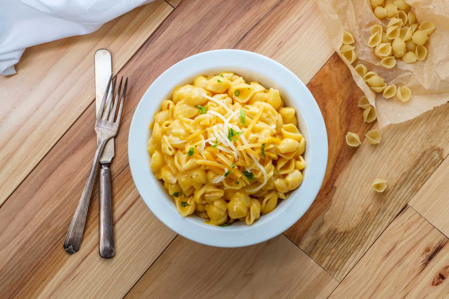 Delicious macaroni and cheddar cheese shell noodles in a bowl