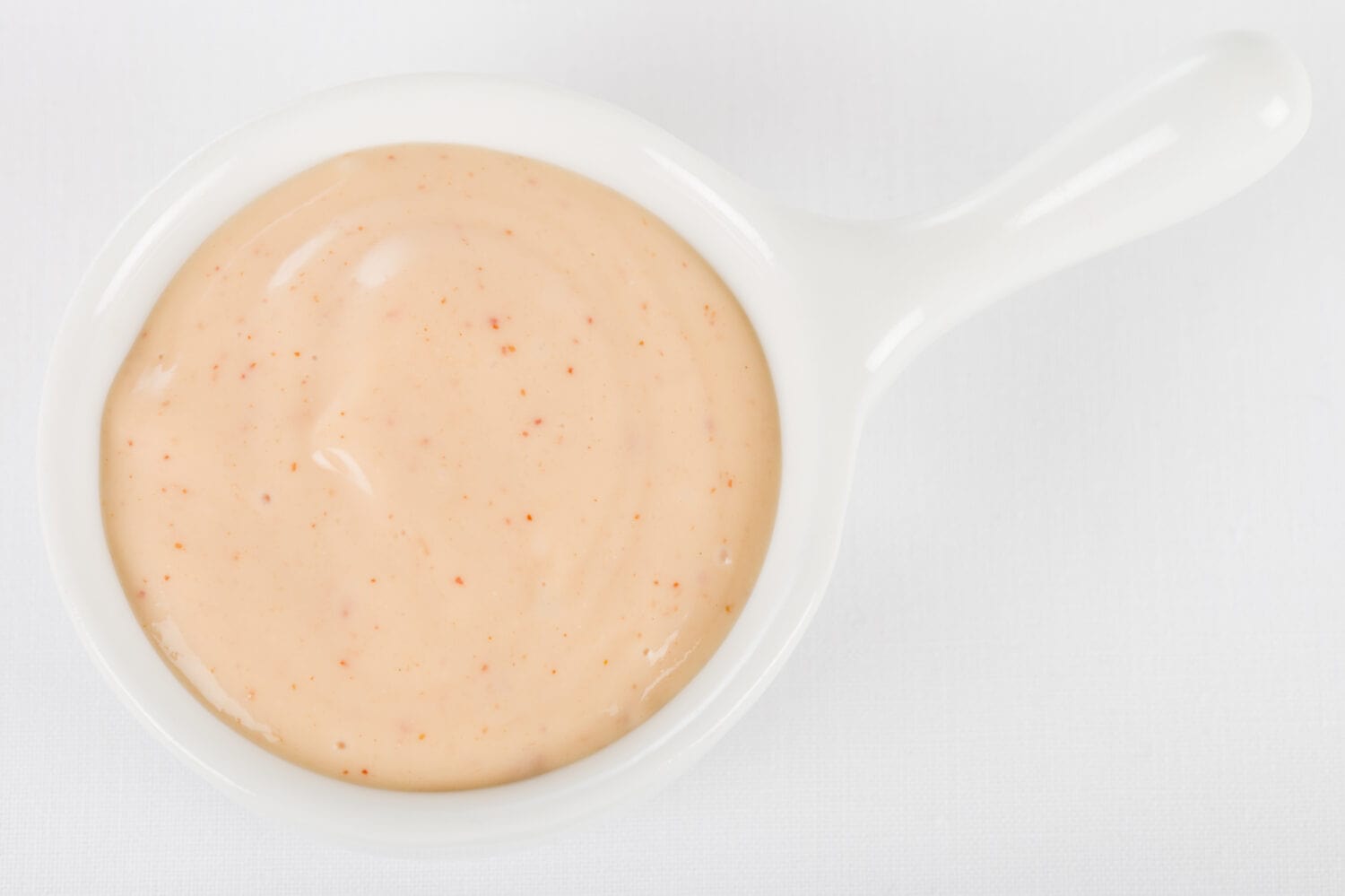 Rose Sauce / Fry Sauce Dip - Bowl of dipping sauce made with ketchup and mayonnaise. Shot from above on a white background.