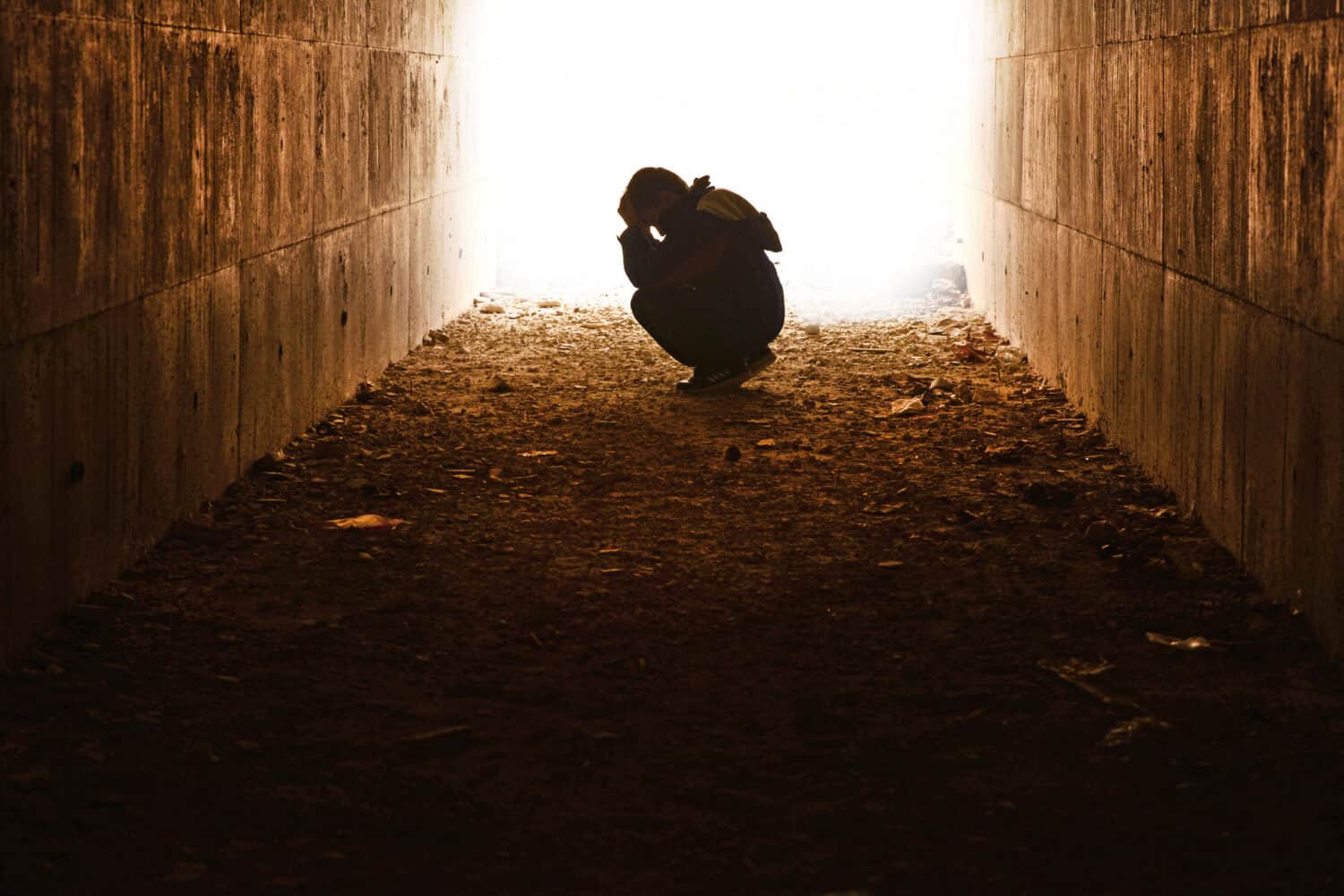 head in the tunnel waiting hands of underprivileged children alone