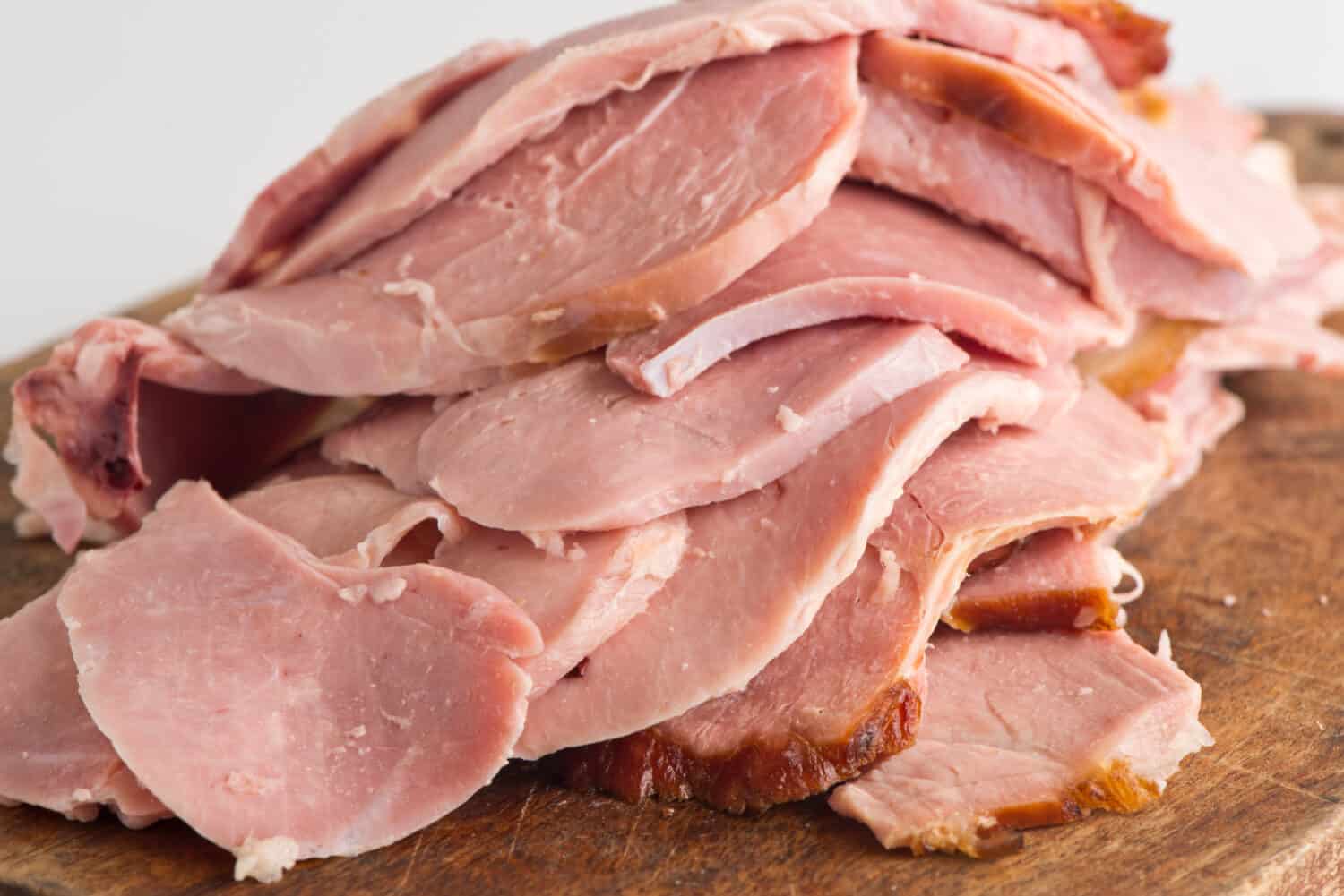 Ham. Cured country ham. Classic delicatessen or butcher shop staple. Whole ham, carved with a butchers knife. Lunch or dinner favorite, meat ideal for sandwiches or served with vegetables.