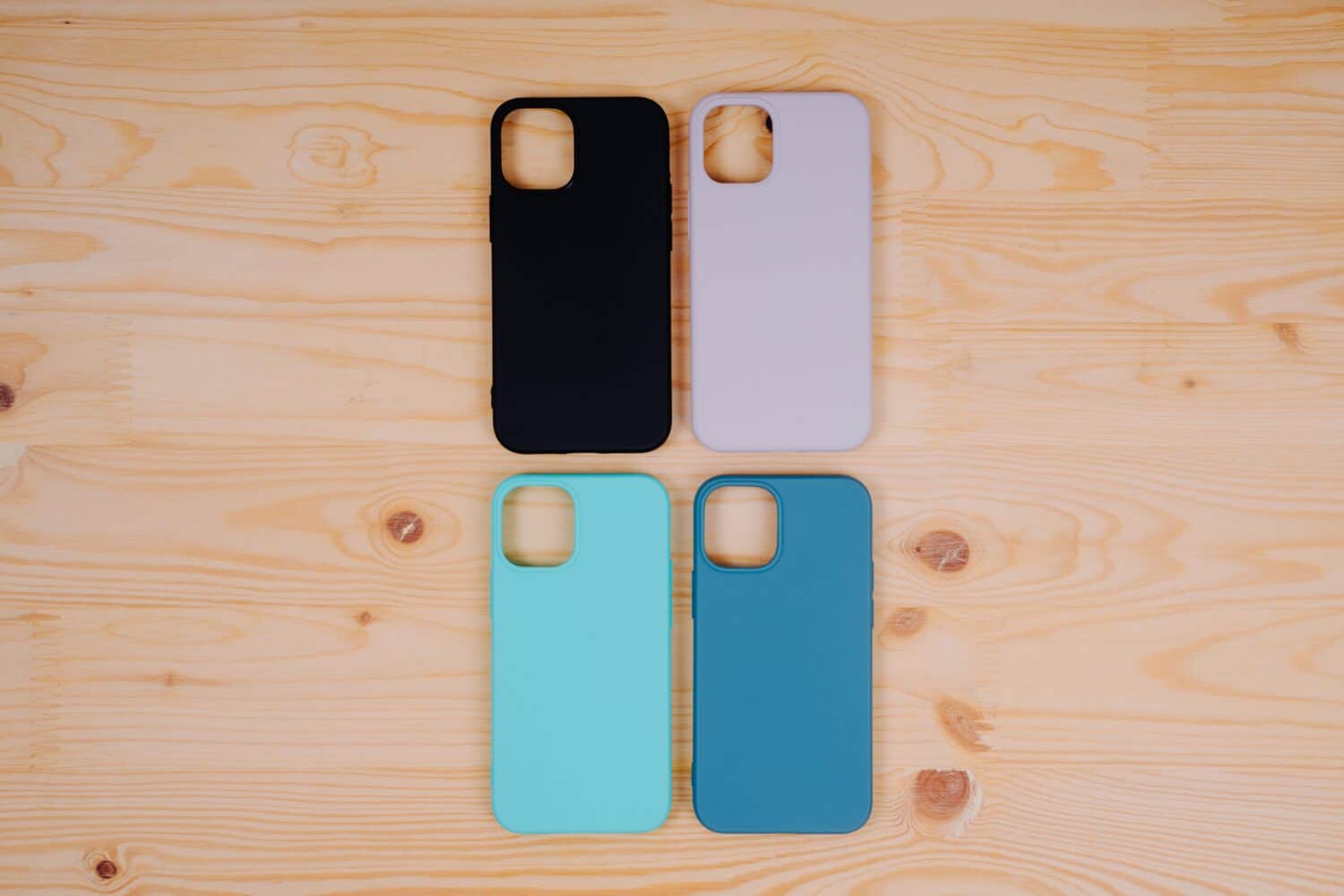 Four silicone smartphone cases. Protective smartphone cases in black, beige, mint and turquoise colors.