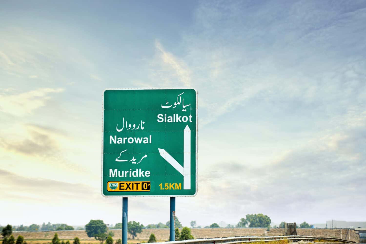 Road sign indicating exits towards sialkot, narowal and muridke on motorway in punjab pakistan