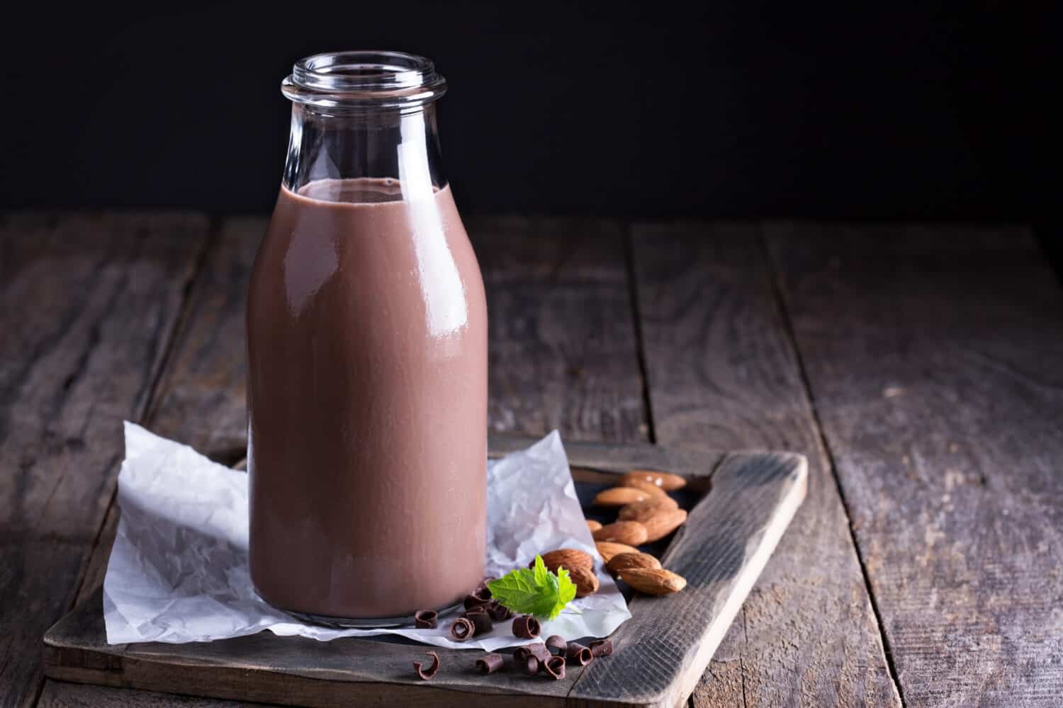 Homemade almond chocolate milk in a bottle