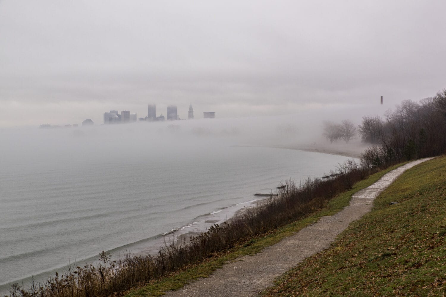 A foggy view of Lake Erie and downtown Cleveland, Ohio from Edgewater Park / Reservation.
