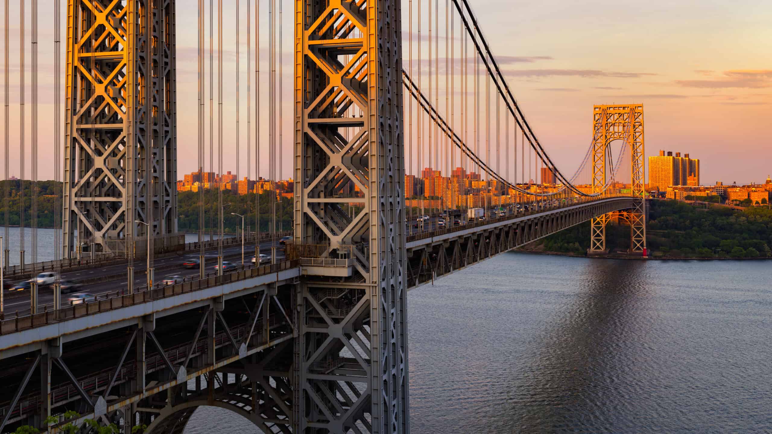 The George Washington Bridge across the Hudson River at sunset. New York City, USA