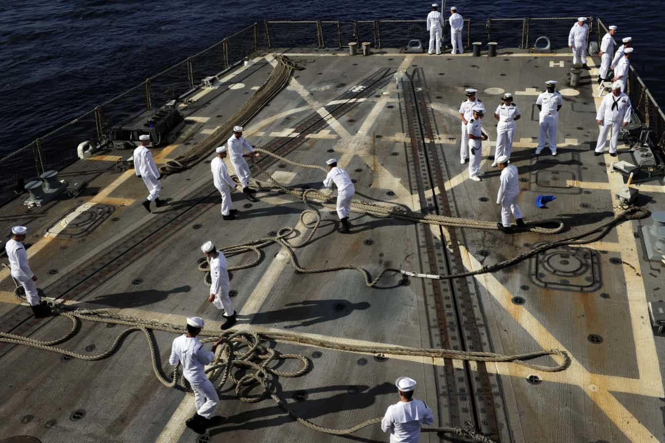 Latvia+navy | Sailors arrange lines after departing Riga, Latvia.