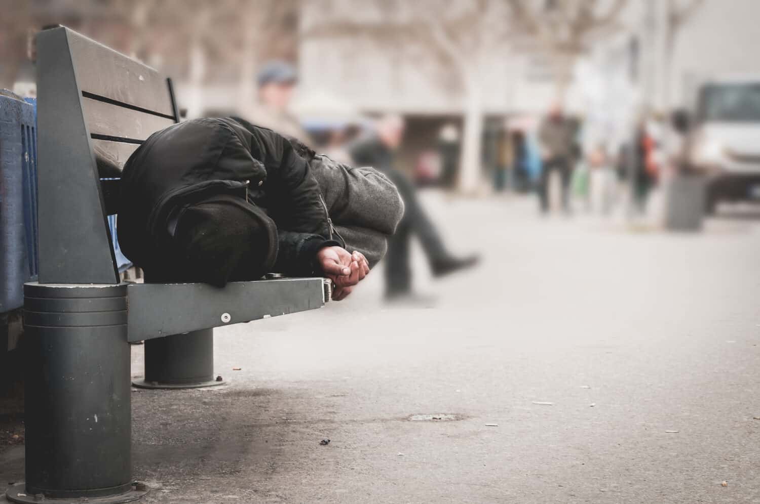 Poor tired depressed hungry homeless man by Srdjan Randjelovic