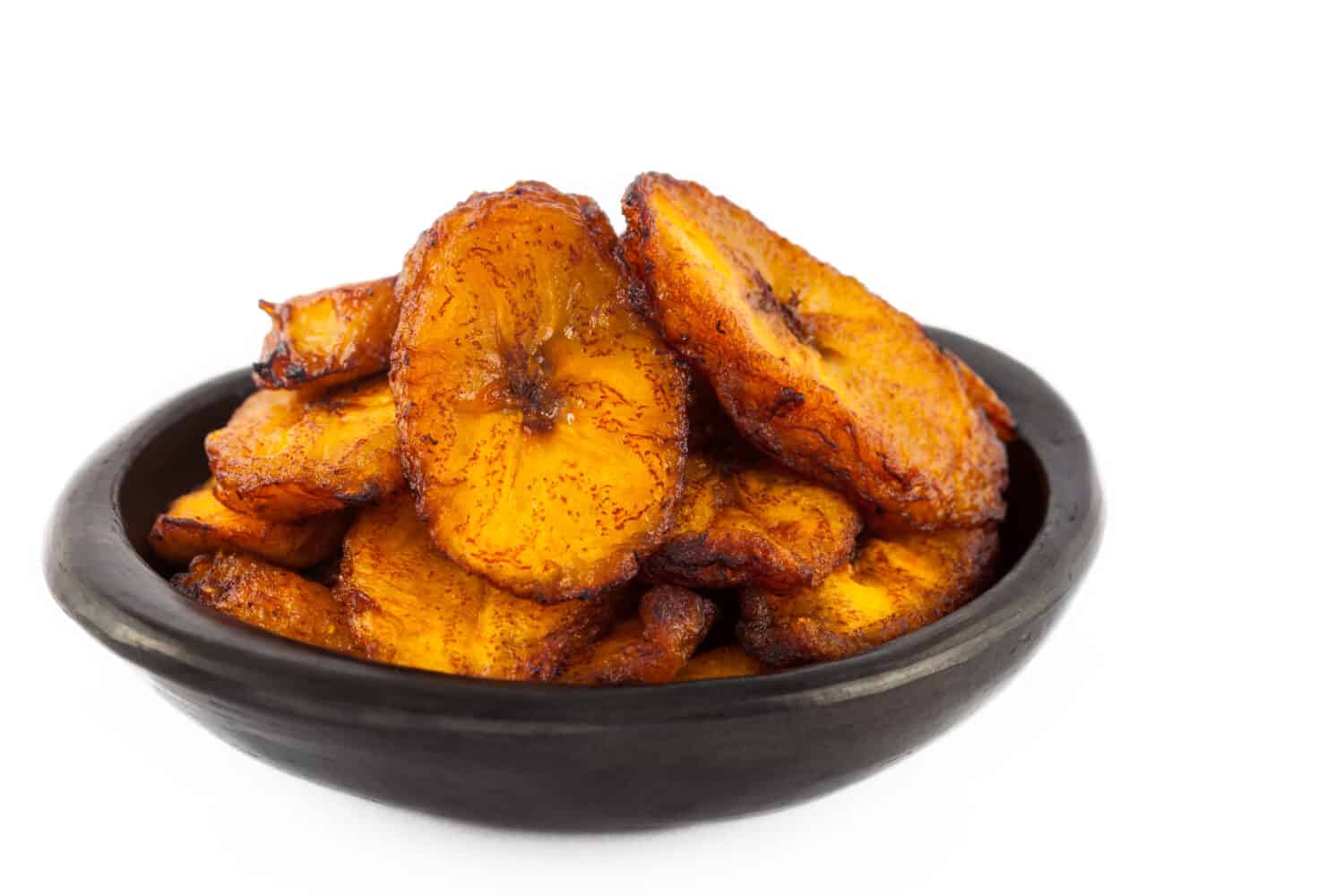 Deep fried ripe plantain slices isolated in white background