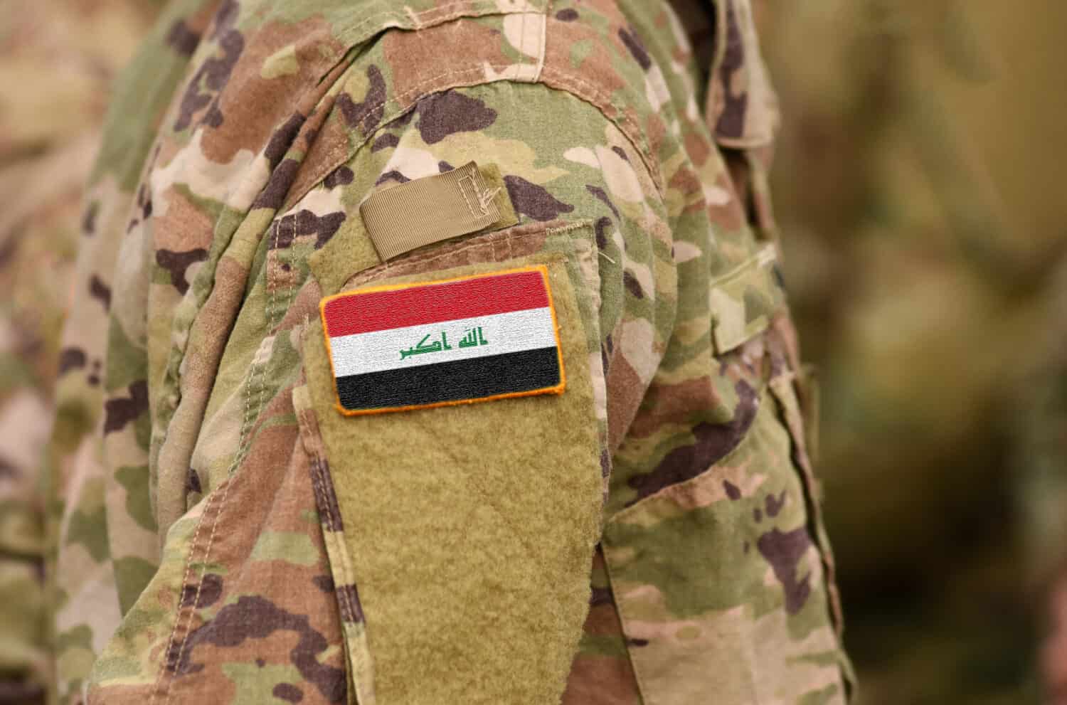 Iraq flag on soldiers arm. Iraq troops (collage).