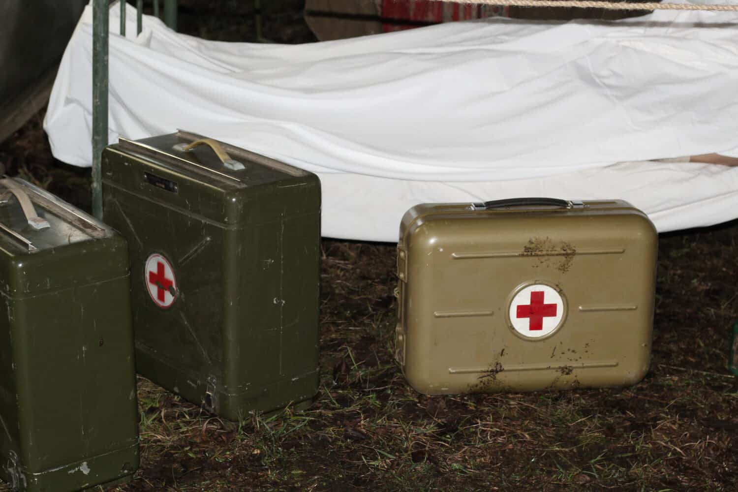 Military tent hospital. A mobile medical tent with a stretcher and medical bags. First aid to victims.
