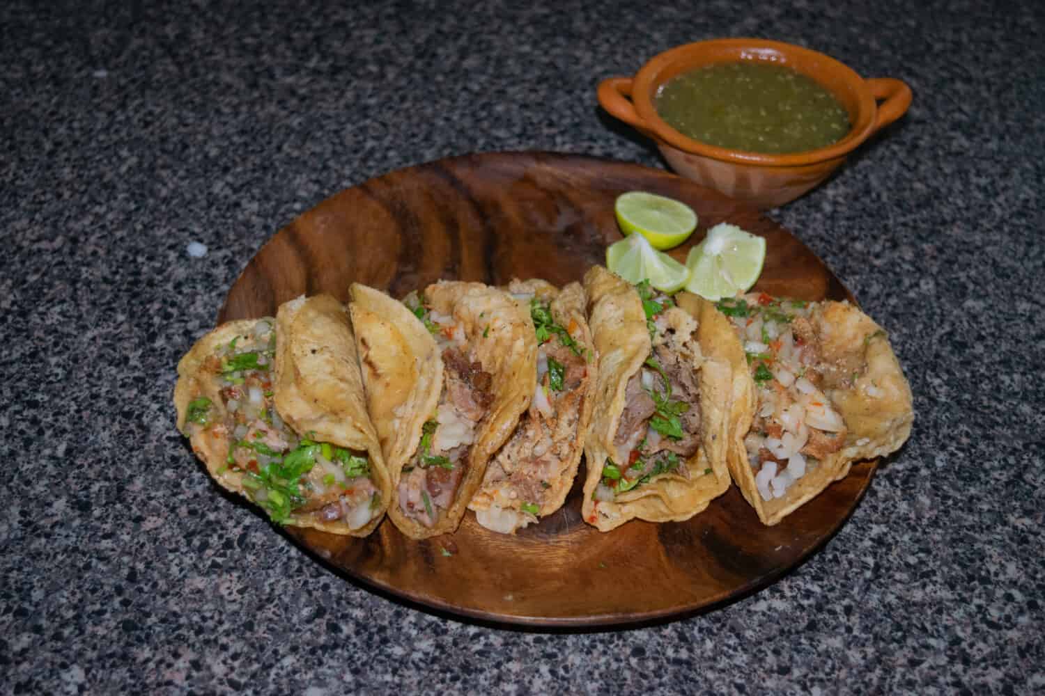 Mexican street tacos with tripe, steak and suadero and green sauce