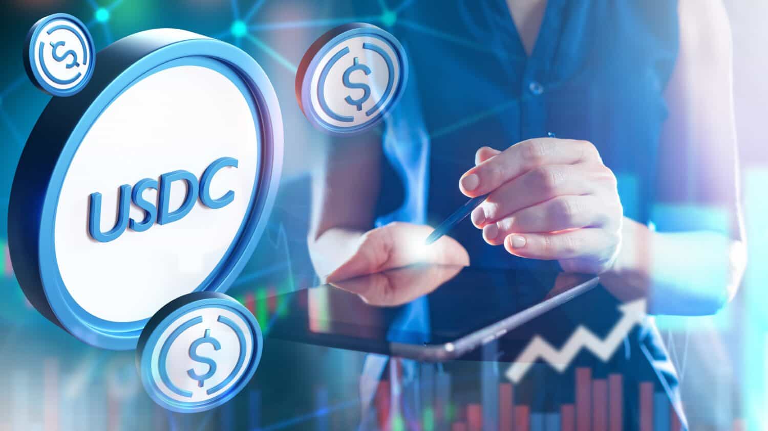 USDc coin. Hands of cryptocurrency trader. Woman with tablet. Investing in USDc. Trading with digital dollar. Blockchain stablecoin. USDc exchange rate. Digital money. USD coin. Online payments