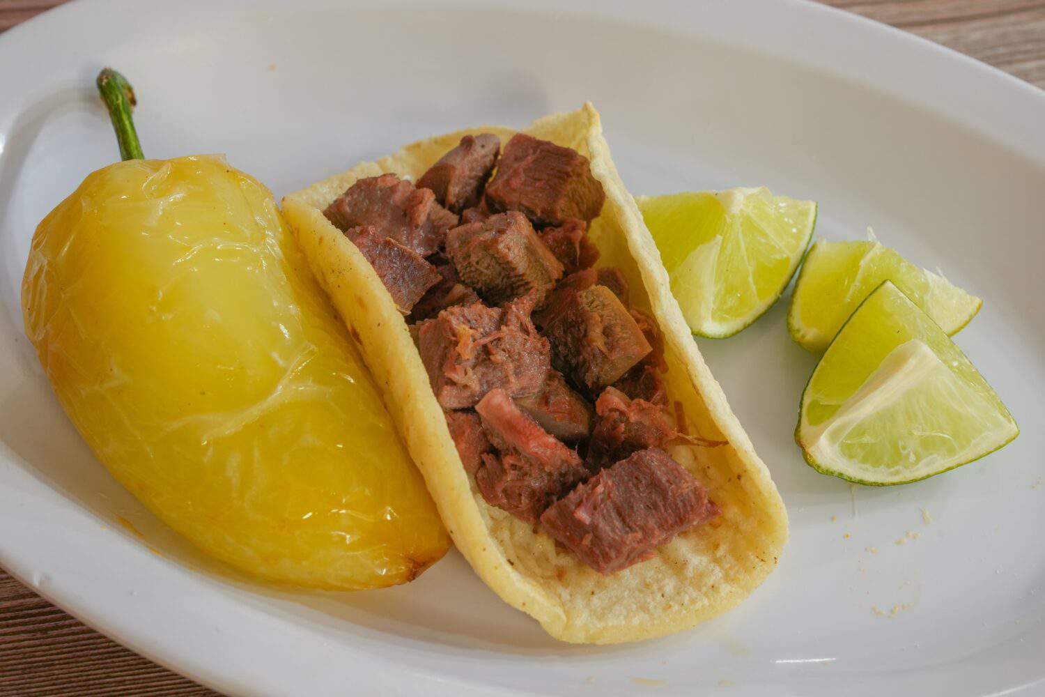 tacos lengua on a wooden background