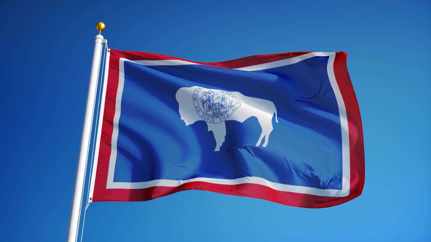 Wyoming (U.S. state) flag waving against clear blue sky