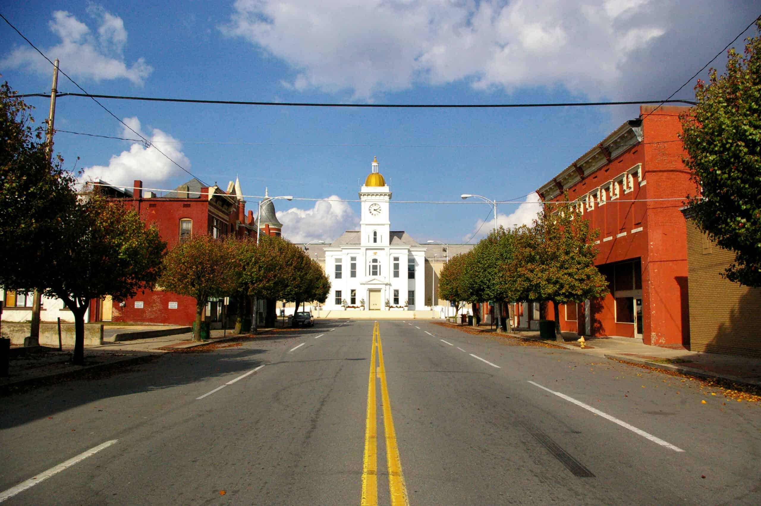 Looking down Main Street in Pine Bluff, Arkansas, USA with the Jefferson County Courthouse in the background. by Roland Klose