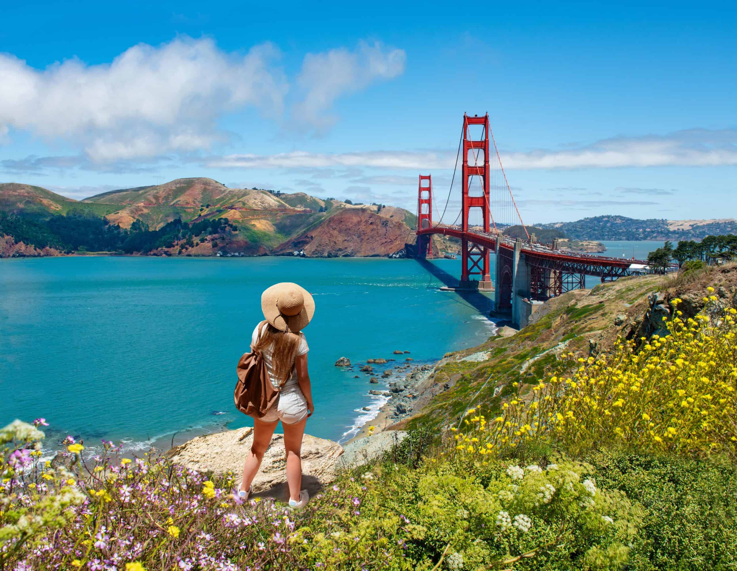San Francisco CA people | Girl looking at beautiful summer coastal landscape, on hiking trip.
