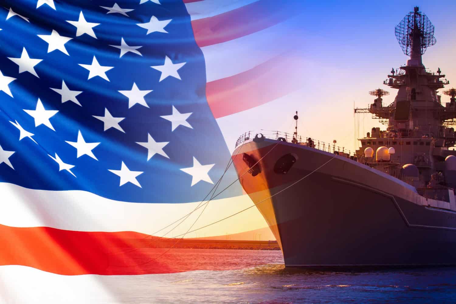 An American ship is moored in the Harbor. Ship on the background of the us flag. American fleet. The naval forces of America. us army. Participation of ships in military conflicts.