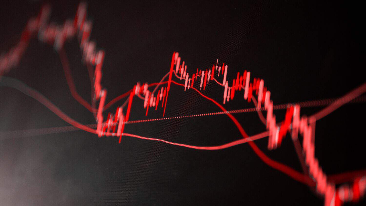 The red crashing market volatility of crypto trading with technical graph and indicator, red candlesticks going down without resistance, market fear and downtrend. Cryptocurrency background concept.