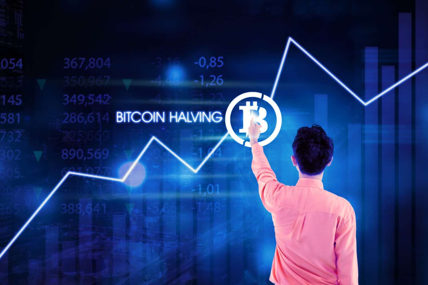 Man pressing bitcoin icon. Price of bitcoin is increasing in the cryptocurrency market after bitcoin halving event