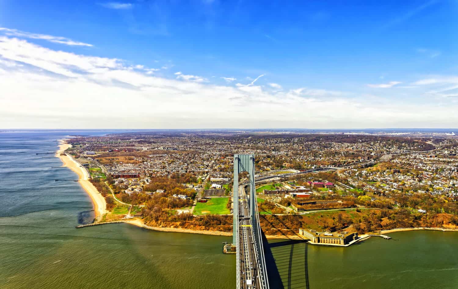 Aerial view of Verrazano-Narrows Bridge over Narrows. It connects Brooklyn and Staten Island. It is strait connects Upper Bay with Lower Bay. View on Fort Wadsworth Bunker and Light in Staten Island