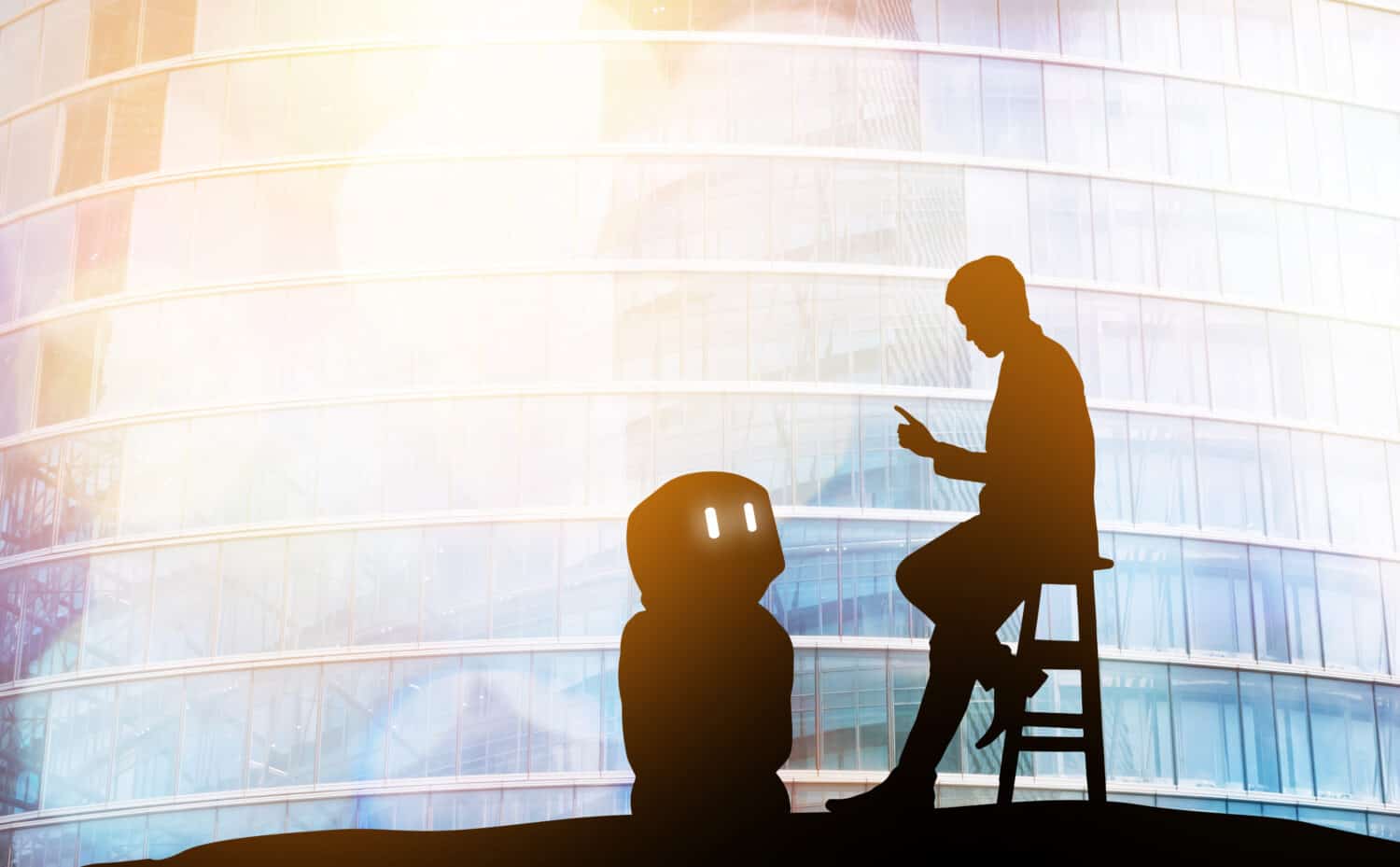 Robot assistant technology , industry 4.0 , artificial intelligence trend concept. Silhouette of business man talking to automation robo advisor. Bokeh flare light effect with building background.