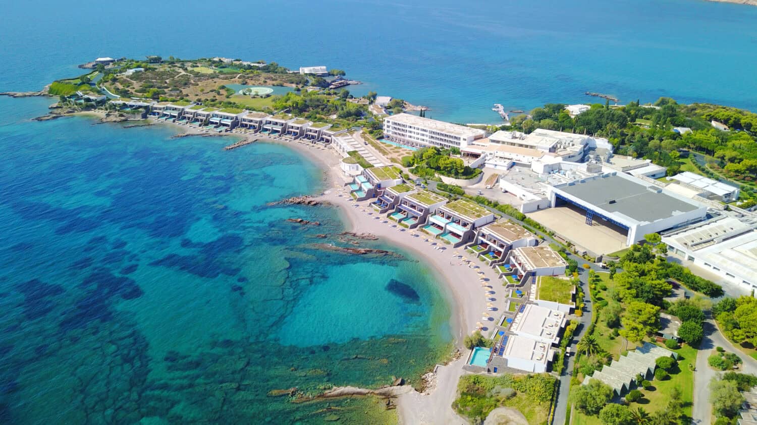 Aerial birds eye view photo taken by drone of Grand Resort Lagonissi resort with turquoise clear waters