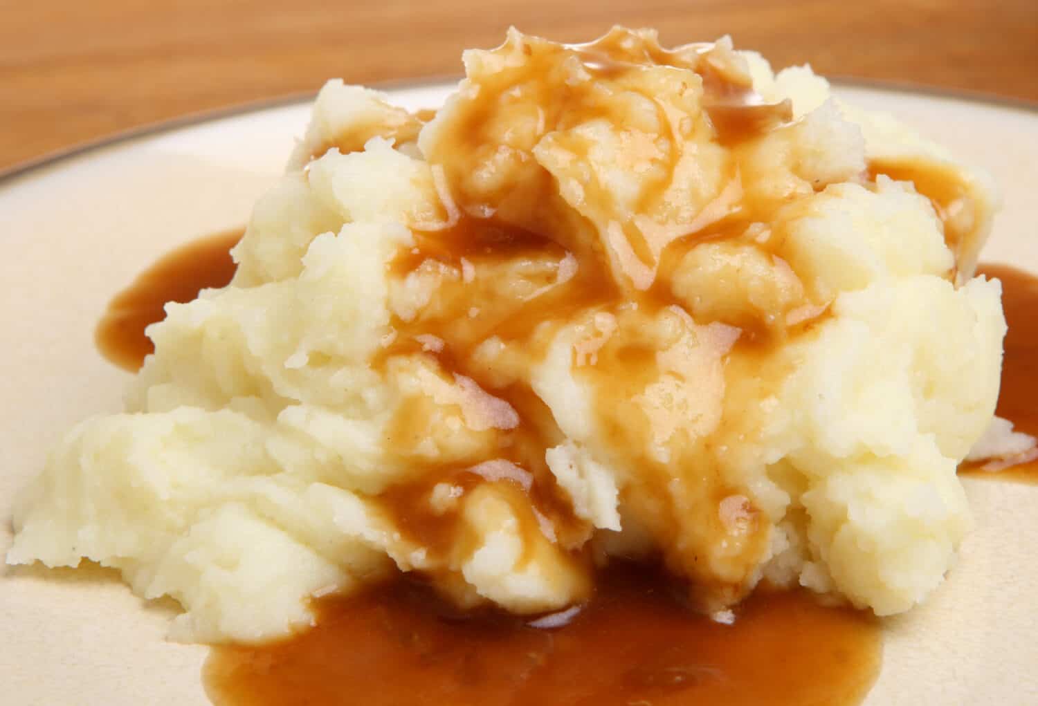 Mashed potato with gravy poured over.