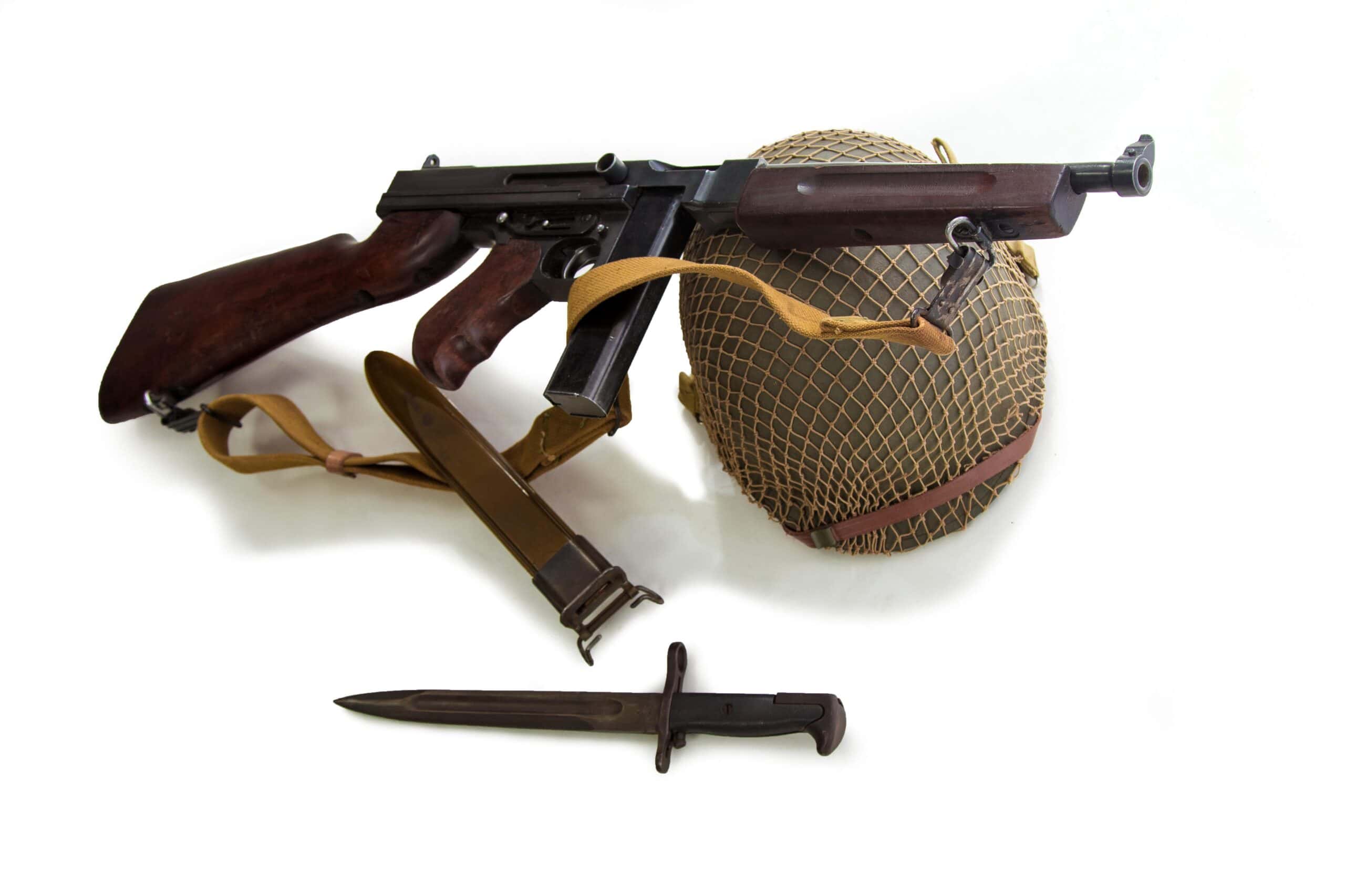 Marine Corps Colonel | Weapon of an American Marine, helmet, knife and submachine gun of the period of World War II over white background
