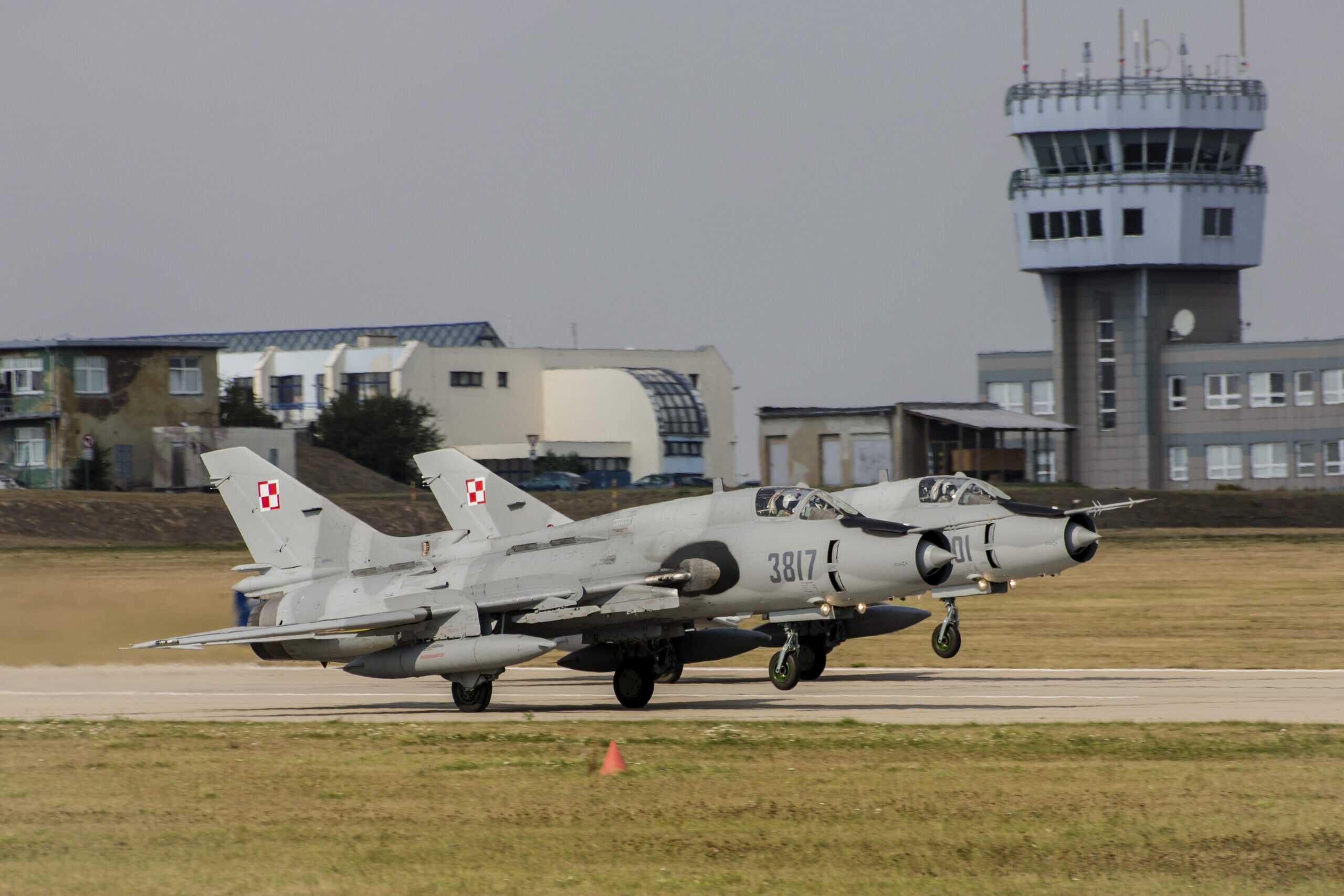 NATO Airfield | Two Polish Air Force Su-22 fighter-bombers at a NATO exercise.