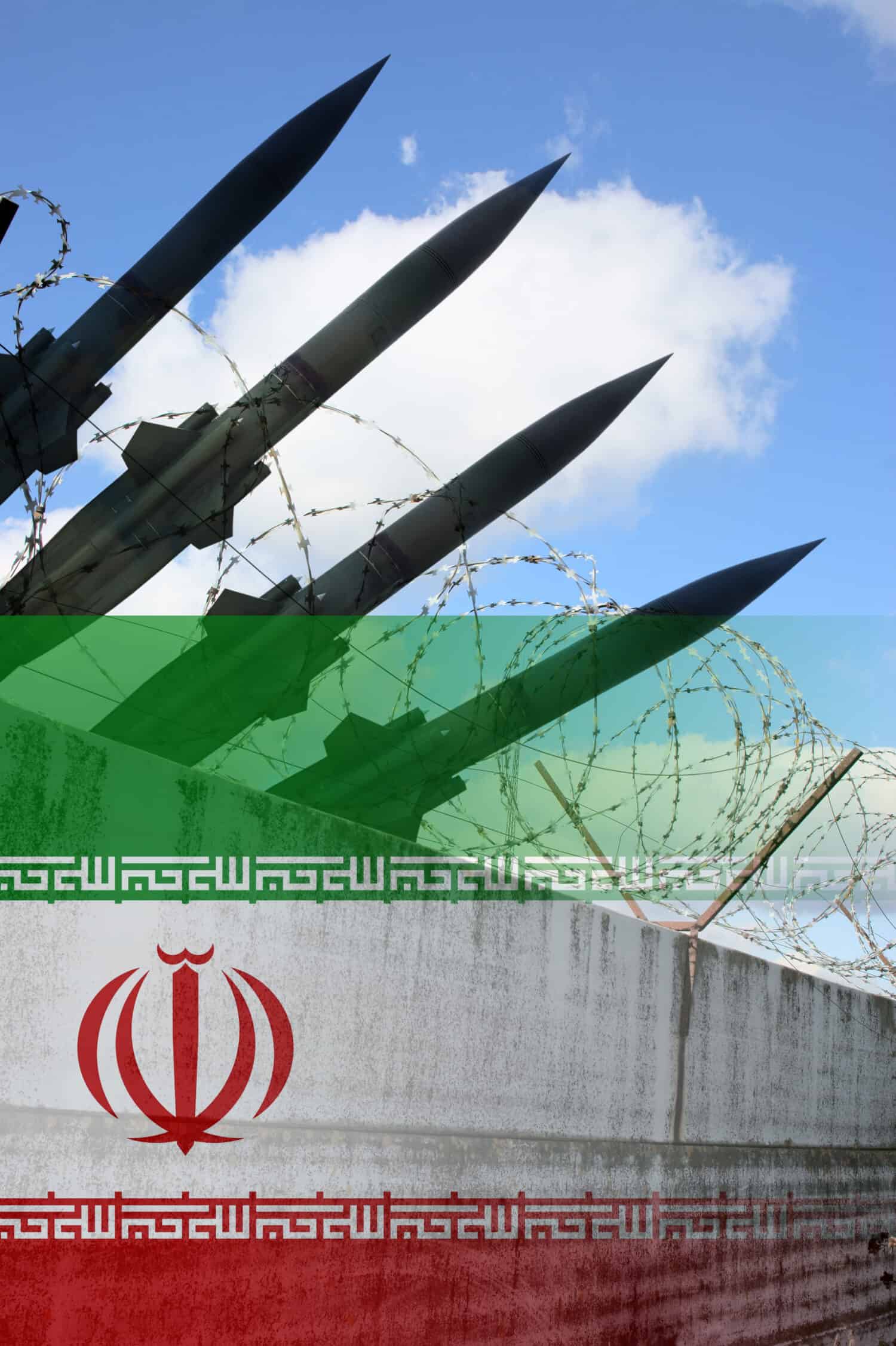 Military rockets, wall with barbwire and Iran national flag by Valery Evlakhov