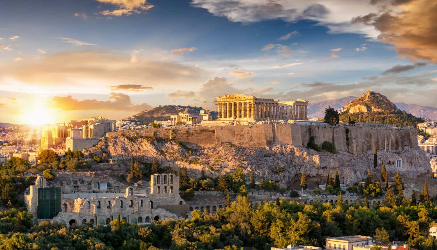 The Acropolis of Athens, Greece with the Parthenon Temple on top of the hill during a summer sunset