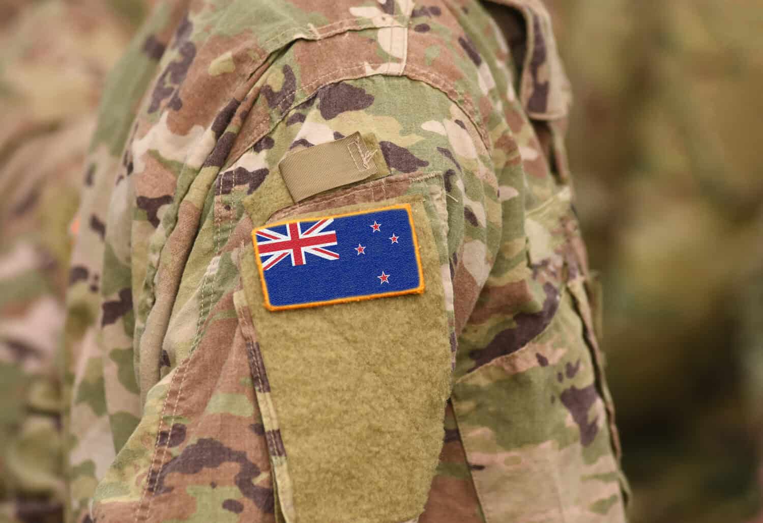 Flag of New Zealand on soldiers arm (collage).