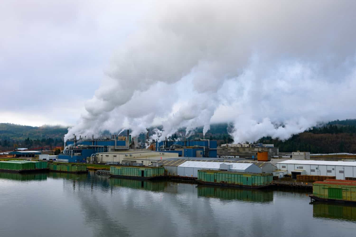 Factory at beautiful Columbia river bank, Washington and Oregon in calm weather