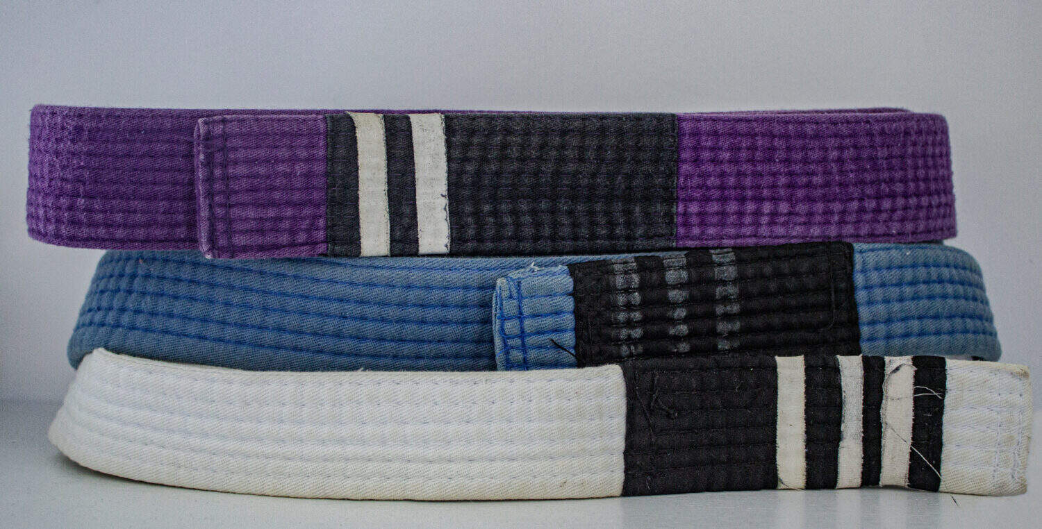 Jiu -jitsu belts close-up (white, blue and purple)
