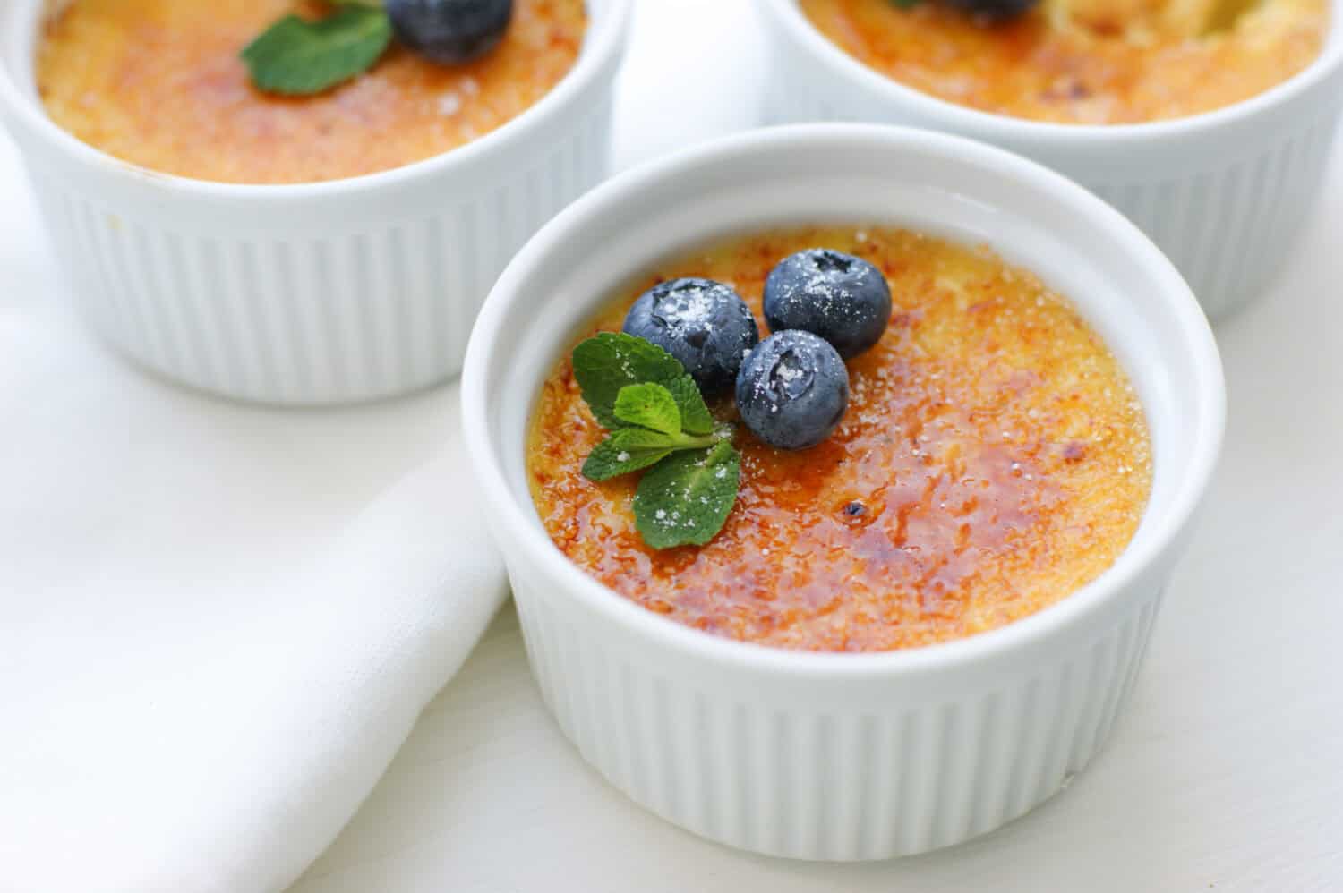 Creme brulee is a delicate creamy dessert with a delicious caramel crust, which is so nice to crack with a spoon.