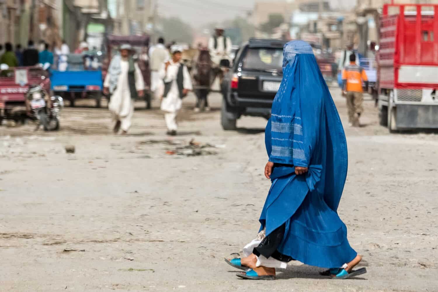 Afghan woman in hijab in Kabul, natives of Afghanistan on streets of the city by 279photo Studio