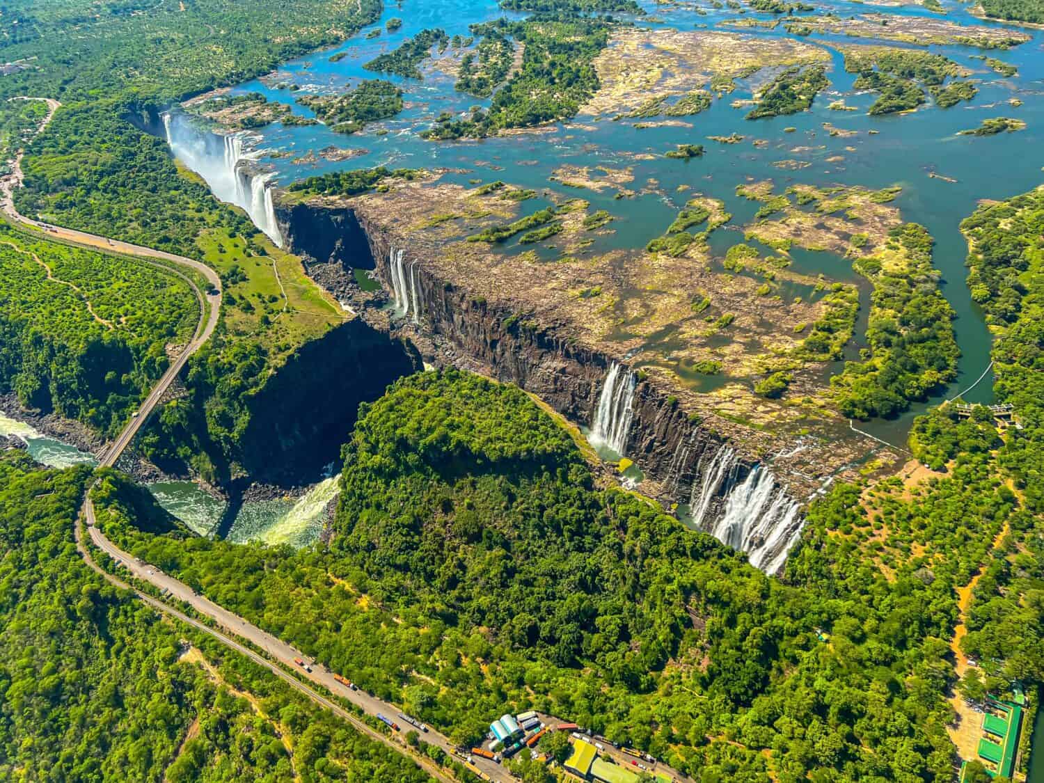 Aerial view of the national park and Victoria Falls. Green Planet. Huge waterfall with natural pools where you can swim. Helicopter flight in Livingstone Canyon Zambia 03.2023 by VILTVART