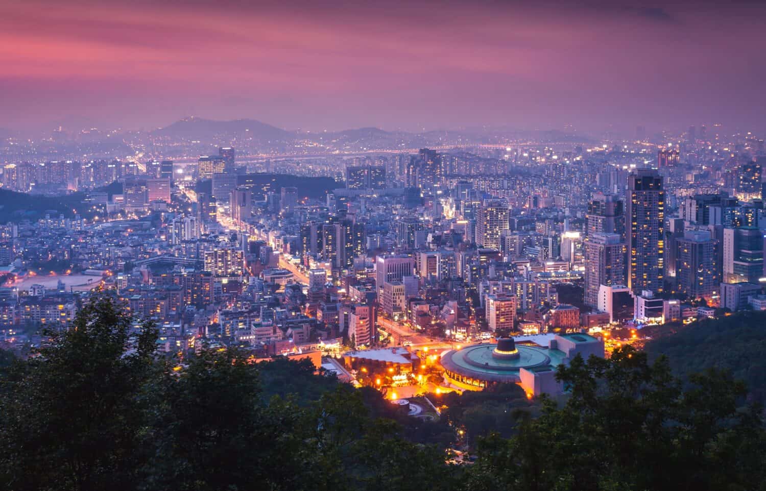 Seoul City skyline and downtown and skyscraper at night is The best view and beautiful of South Korea at Namhansanseong mountain.