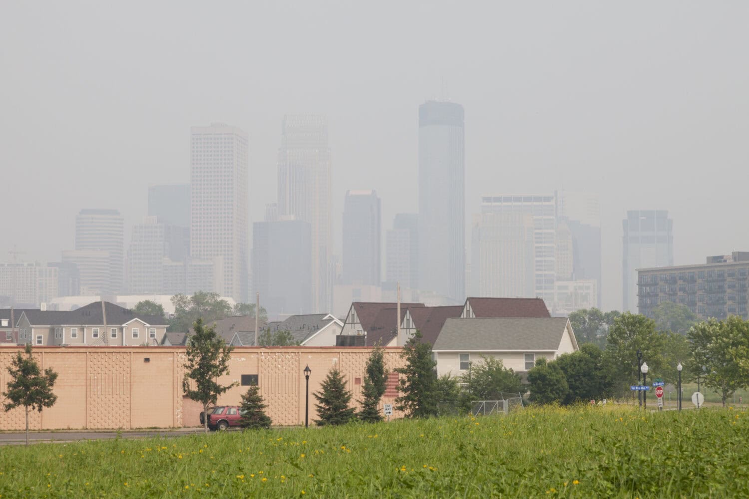 Air pollution in the city of Minneapolis. View of Minneapolis skyline with heavy air pollution from fires in Canada in July 2015.