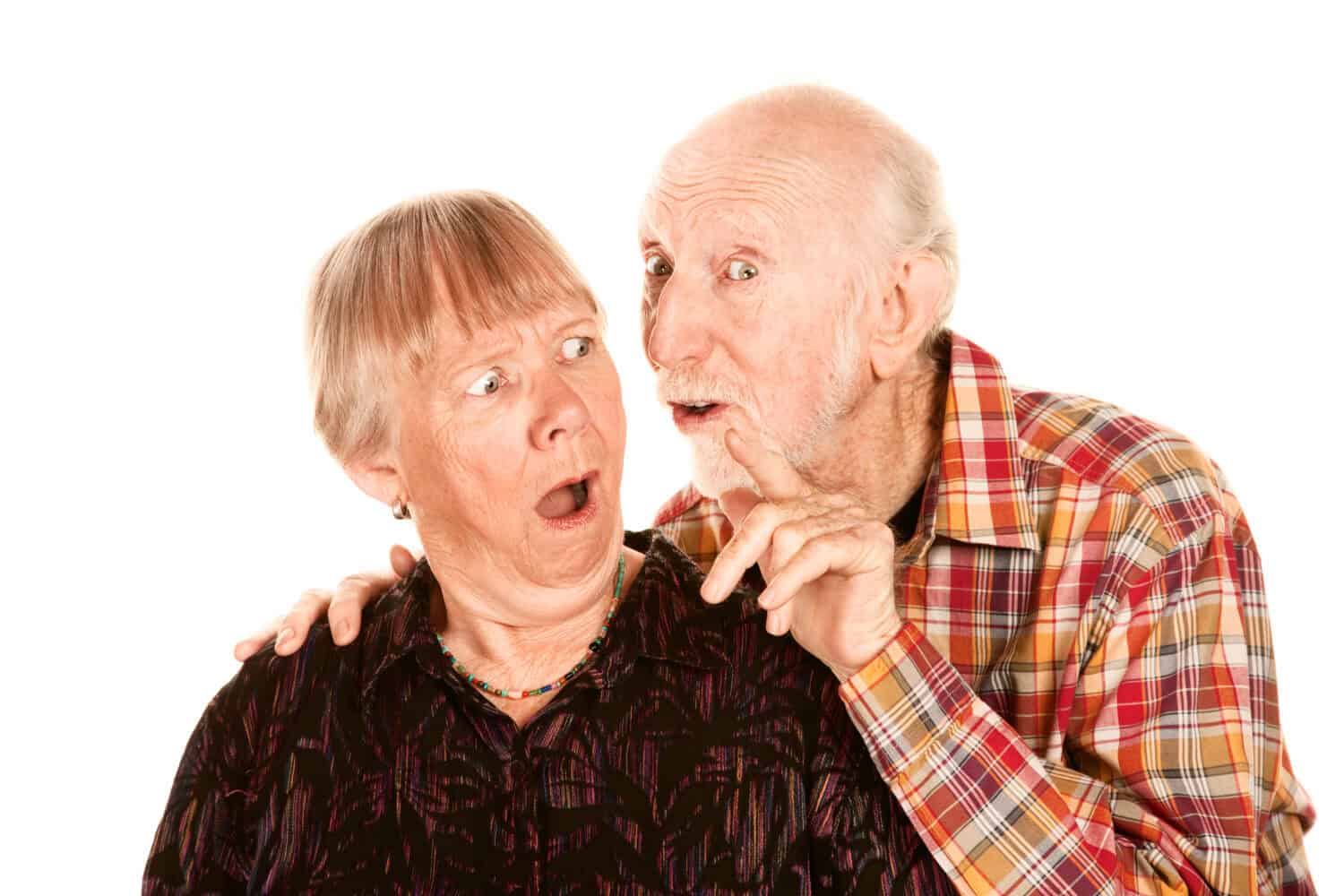 Senior man talking to his shocked wife