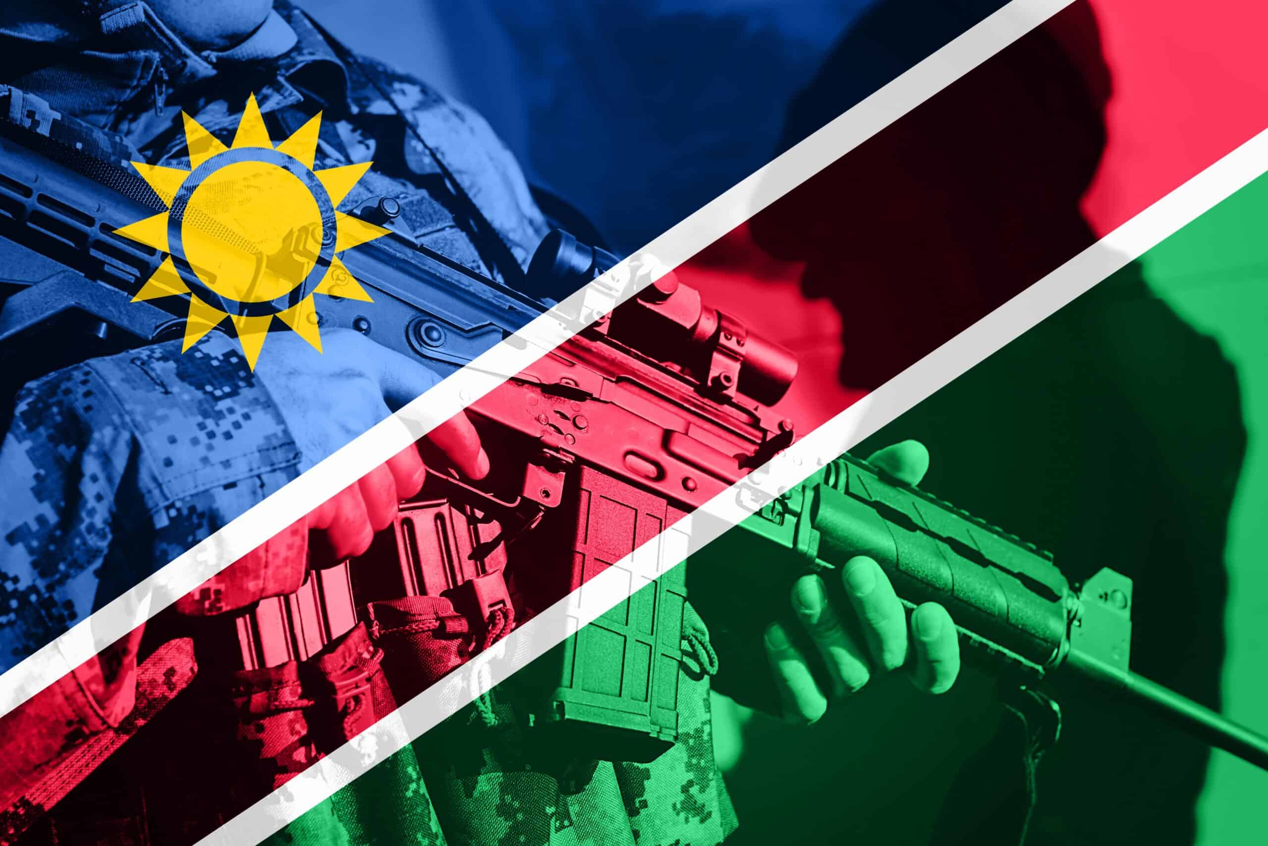 Namibia military | Soldier with machine gun with national flag of Namibia