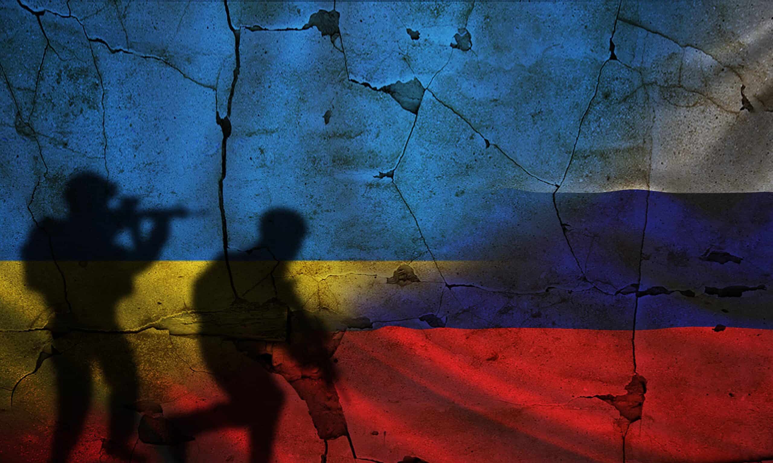 Russia ukraine | Russia vs Ukraine flag on cracked wall, concept of war between russia and ukraine, silhouette of soldiers on russia vs ukraine flag