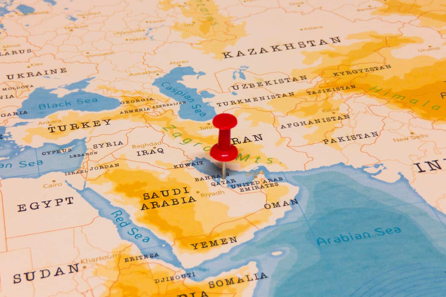 A Red Pin on Qatar of the World Map