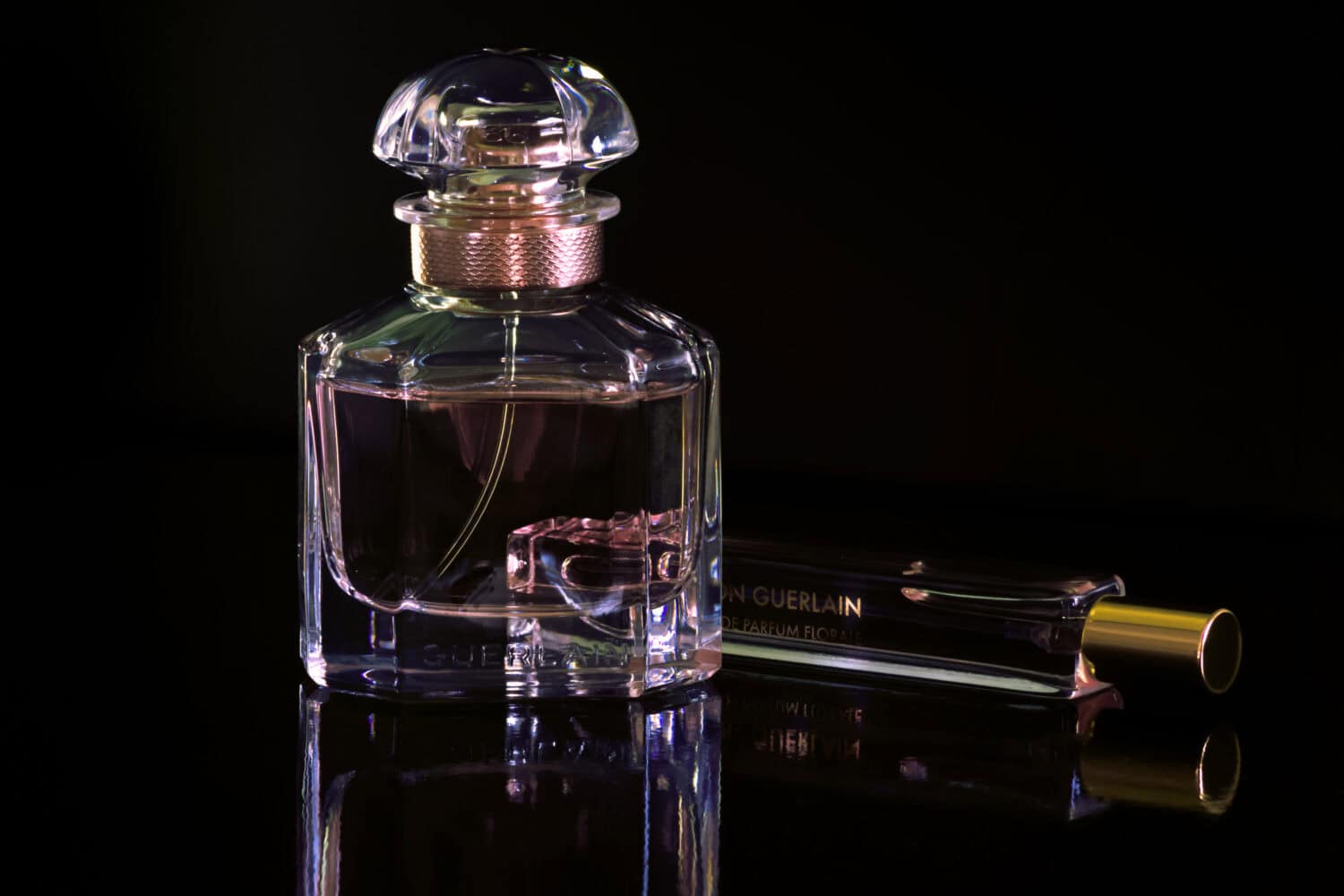 big and little Guerlain perfume bottles packshot