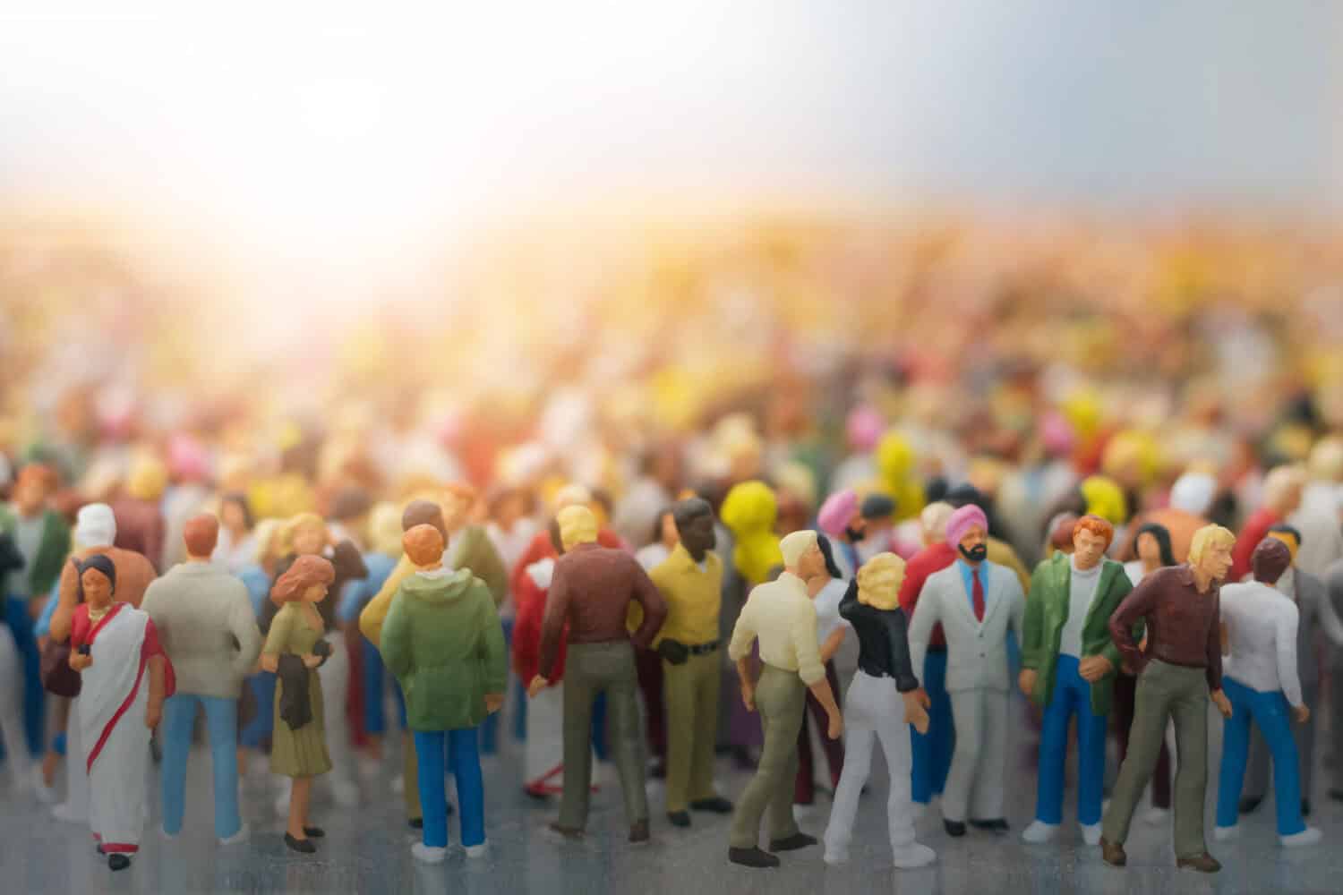 Colorful miniature crowd in the Sun. Multiracial gathering of people.