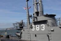 World War II Liberty ship SS Jeremiah O'Brien pointing to Alcatraz Island, in Fisherman's Wharf, San Francisco, California, USA