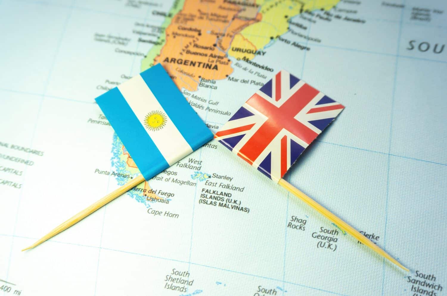 Argentine and British flags placed around the Falkland Islands or the Malvinas Islands. Local conflicts. Territorial disputes. Island war. Sovereignty crisis. Battle of the Falklands.