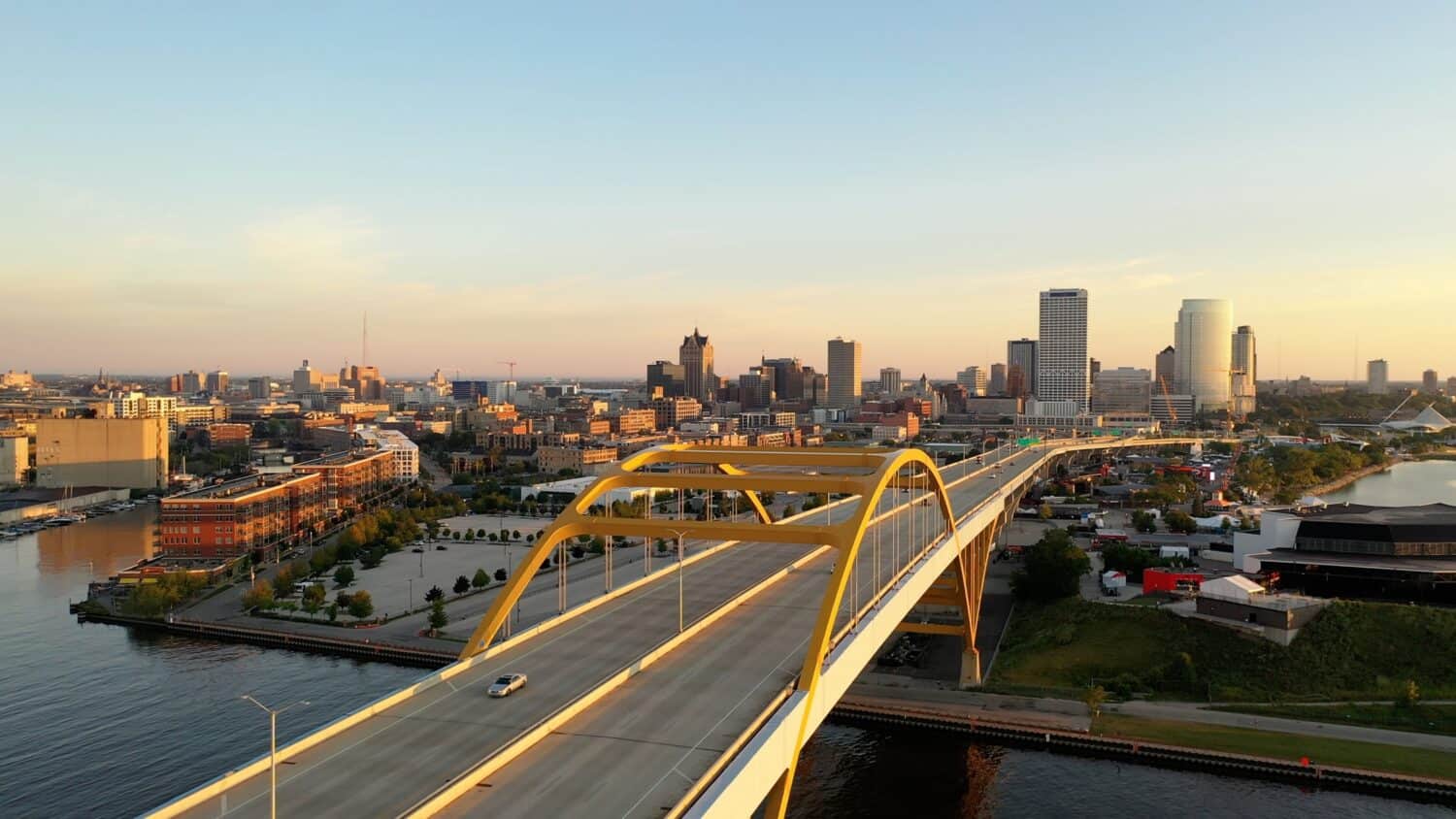 Aerial view of Hoan Memorial Bridge, highway in Milwaukee, Wisconsin, USA. Highway, traffic in morning at sunrise, Downtown in the background. Cityscape, Skyline